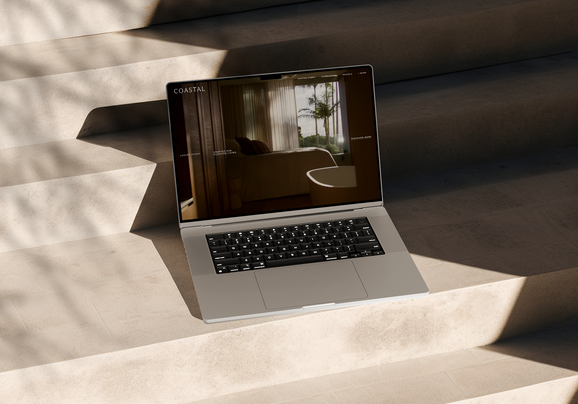 Person sitting on couch working on laptop